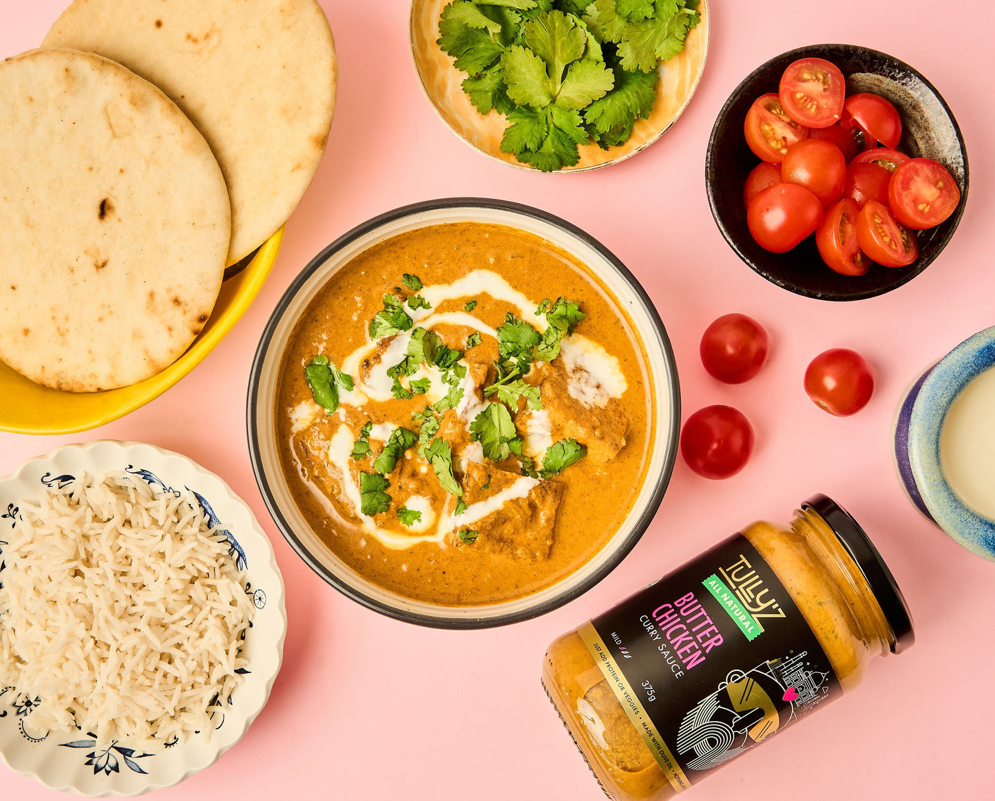 A bowl of Butter Chicken with Tofu, garnished with fresh coriander, ready to be served.