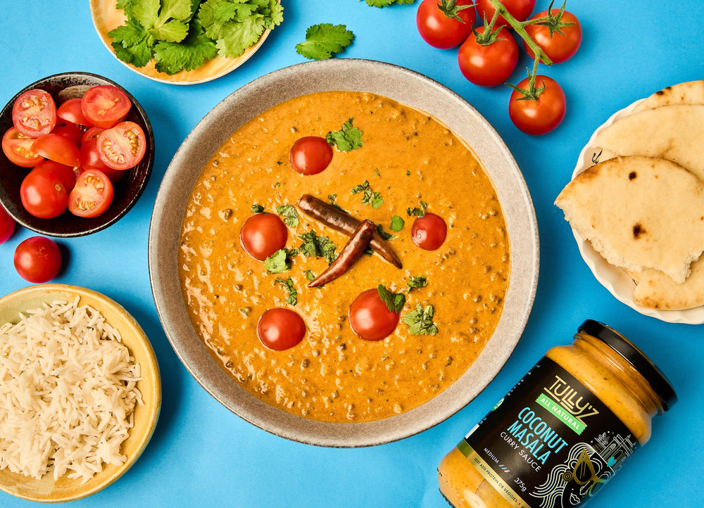 A bowl of Coconut Masala Dahl Lentil Curry garnished with fresh coriander