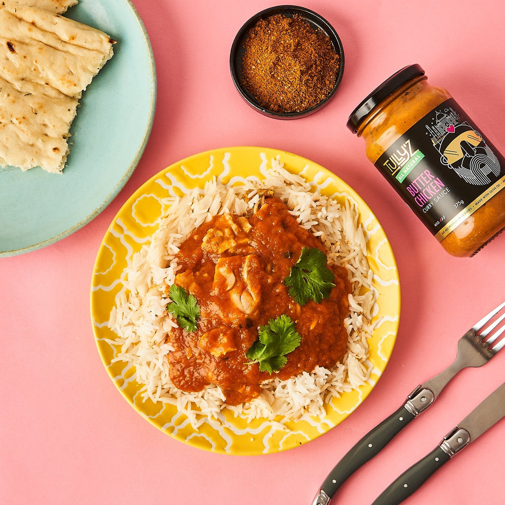 Butter chicken curry served with shredded leftover chicken and fresh coriander.